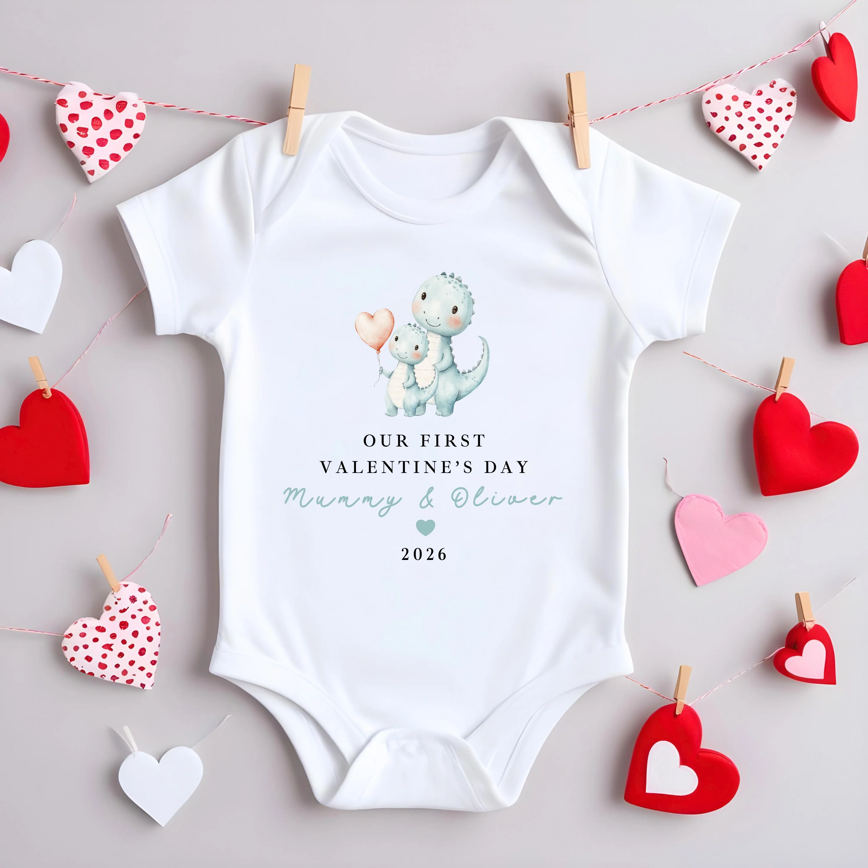 Personalised Blue Dinosaur Our First Valentines Day Baby Grow, Vest or Bib - Image 2