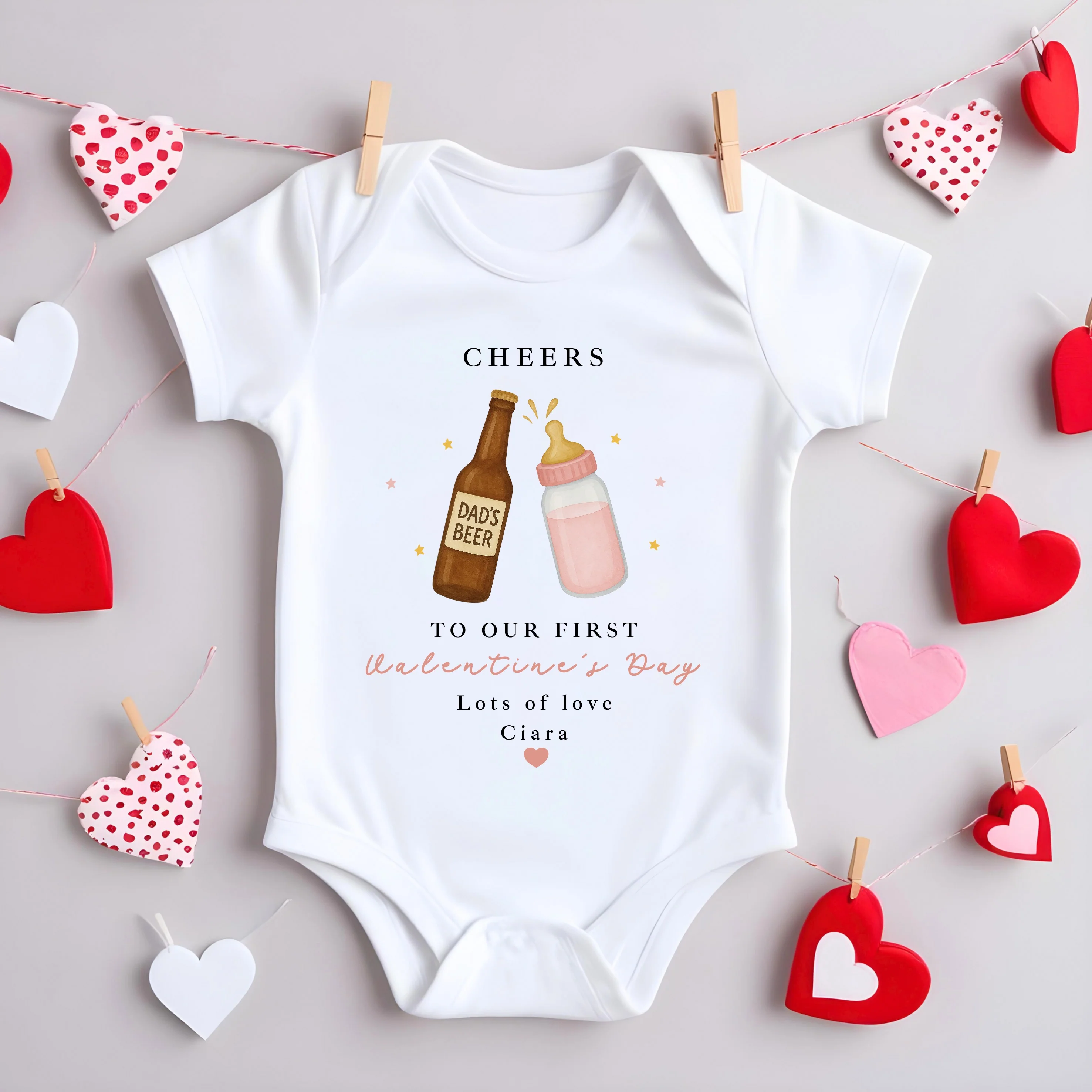 Personalised Pink Cheers Our First Valentines Day Baby Grow, Vest or Bib